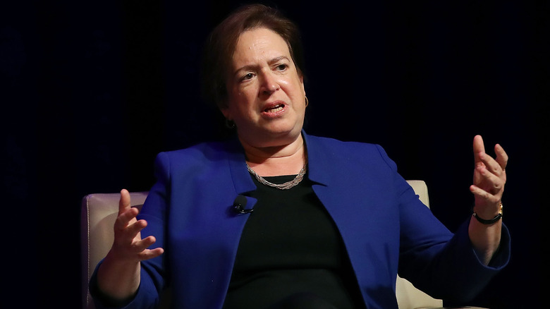 Elena Kagan speaking with hands in a blue jacket