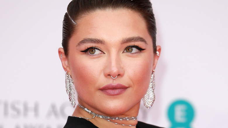 Florence Pugh looking over her shoulder