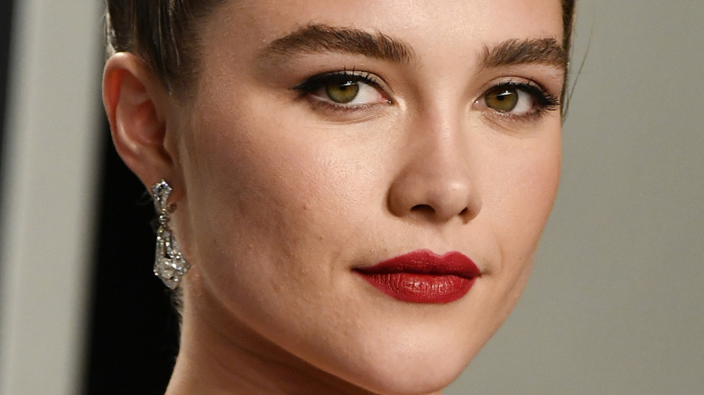 Florence Pugh with her hair pulled back