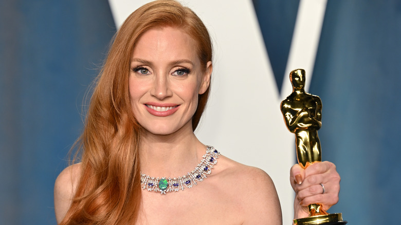 Jessica Chastain, holding her Oscar