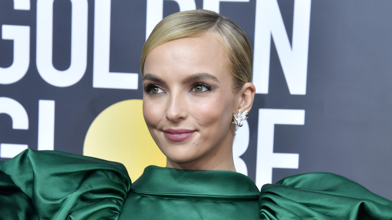 Jodie Comer smiling slightly