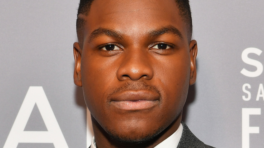 John Boyega slightly smiling