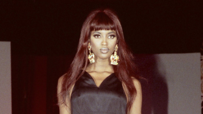 Young Naomi posing on the runway