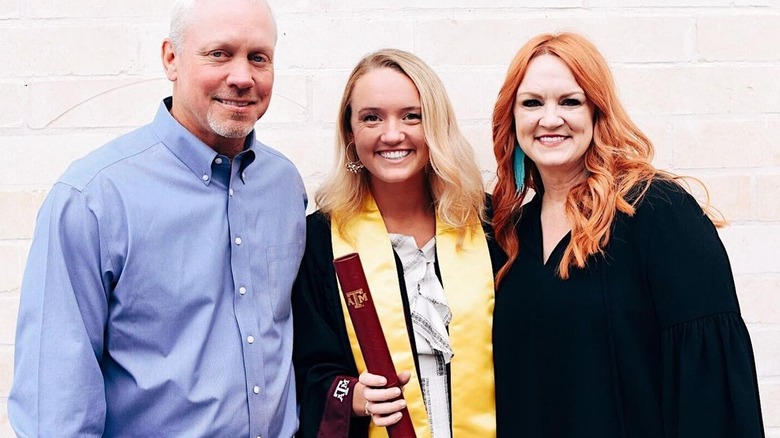 Alex Drummond with her parents at her graduation