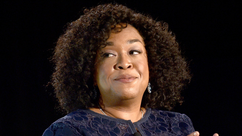 Shonda Rhimes glancing off to side