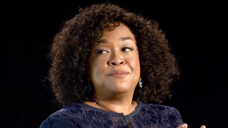 Shonda Rhimes glancing off to side