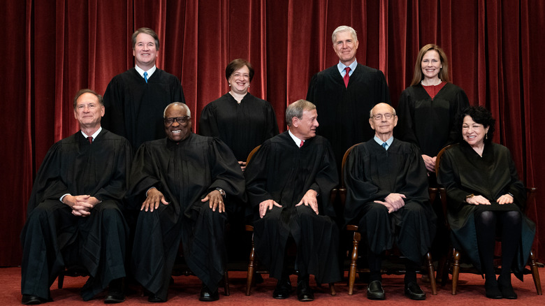 The Supreme Court in a group photo, all smiling