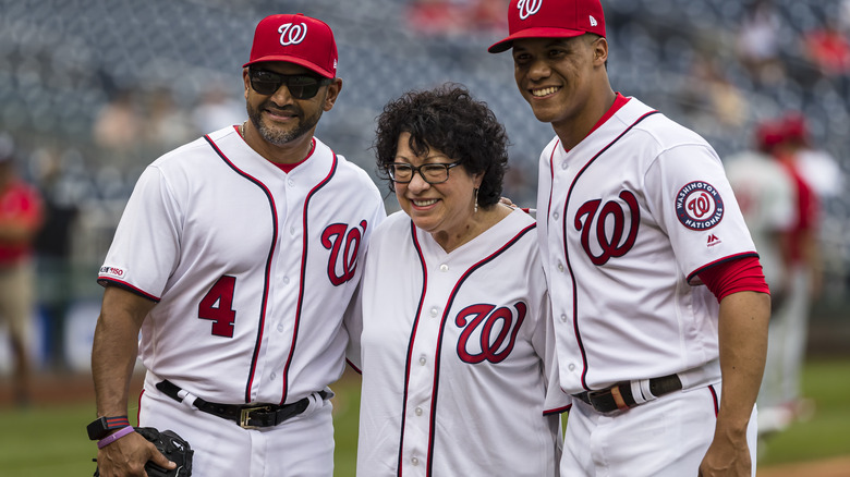 Sonia Sotomayor stands with Juan Soto and Dave Martinez 