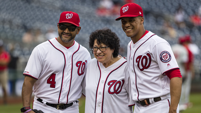 Sonia Sotomayor stands with Juan Soto and Dave Martinez