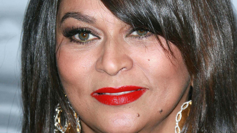 Tina knowles stares at camera