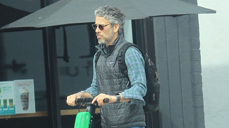 Darren Le Gallo pictured riding scooter in Los Angeles