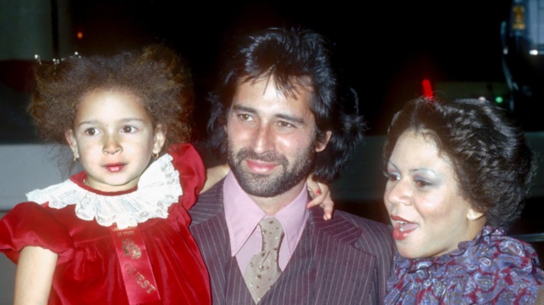 Richard Rudolph holds a young Maya Rudolph, next to her mom Minnie Riperton...