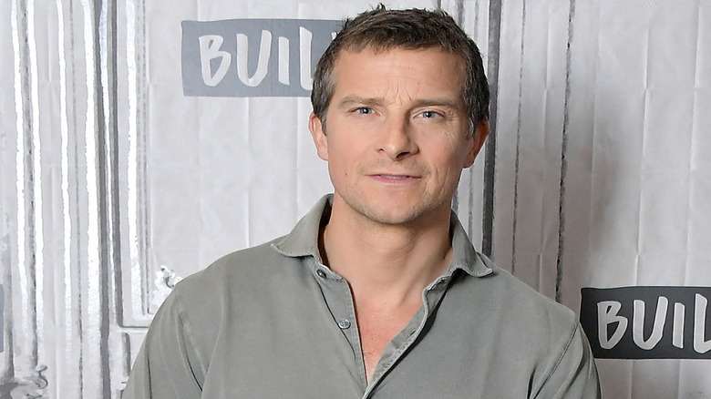 Bear Grylls speaking to camera in a grey shirt