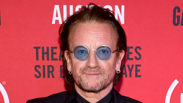 Bono wearing blue-tinted sunglasses