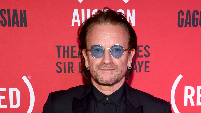Bono wearing blue-tinted sunglasses