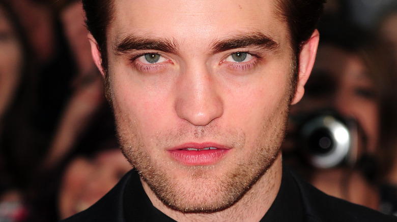 Robert Pattinson with a serious expression