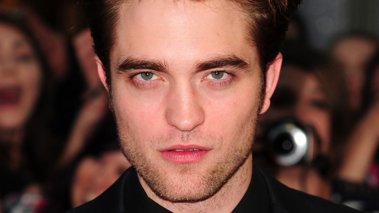 Robert Pattinson with a serious expression