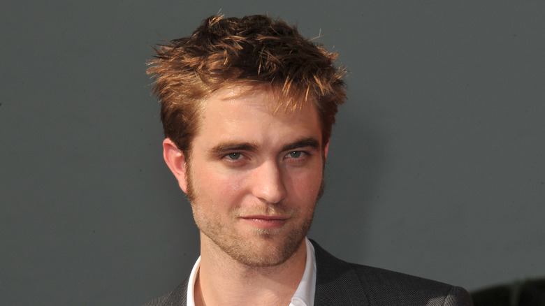 Robert Pattinson smiling slightly