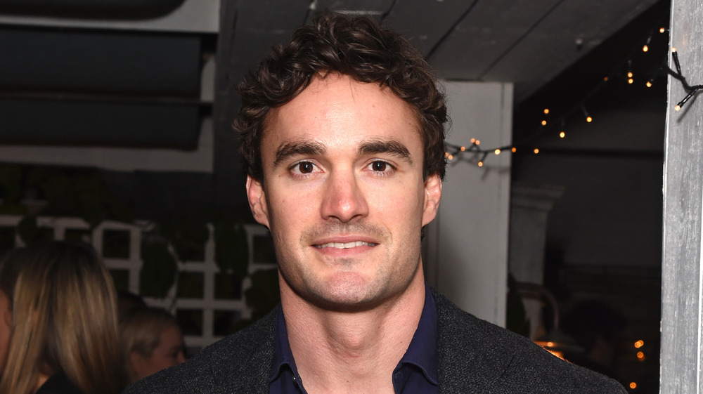 Thom Evans smiling at an event