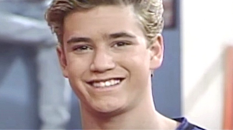 Mark-Paul Gosselaar smiling as Zack Morris