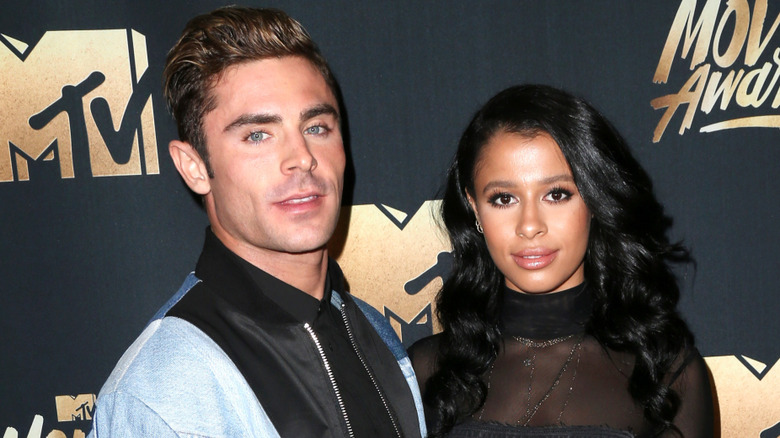 Zac Efron, Sami Miró posing