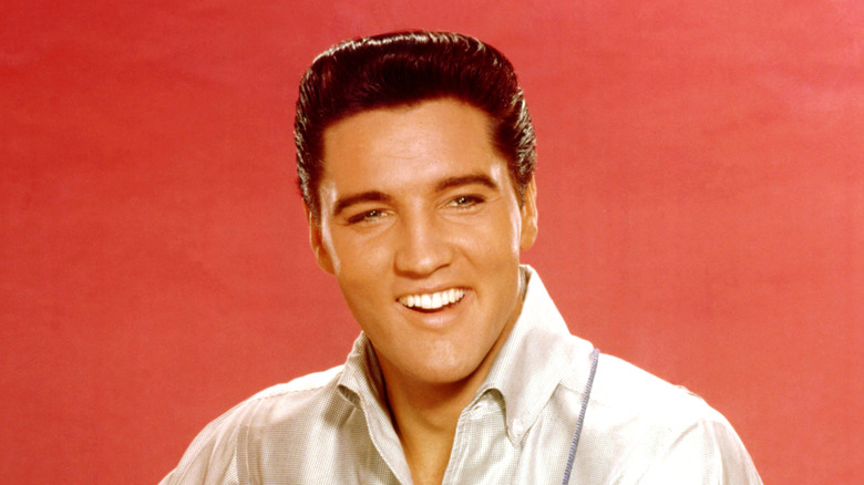 Elvis Presley poses for a photo in 1962