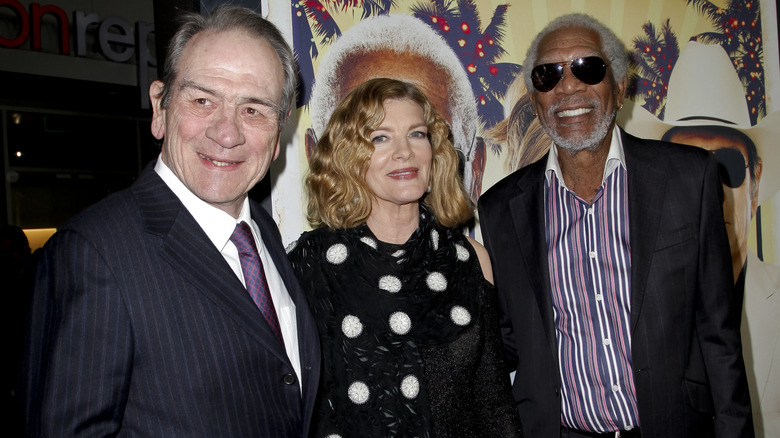 Rene Russo posing with Tommy Lee Jones and Morgan Freeman.