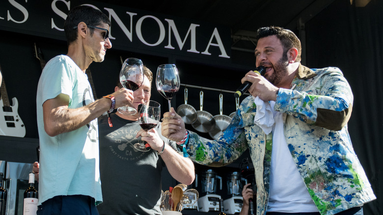 Adam Richman drinking wine with the Beastie Boys
