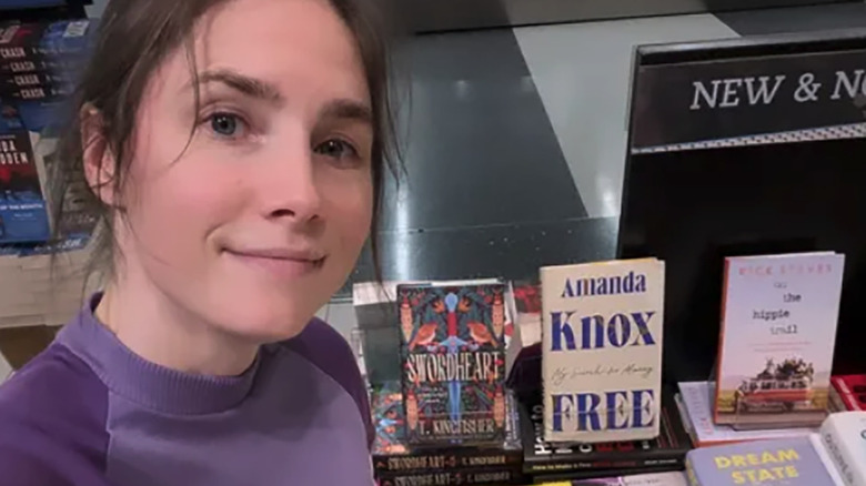 Amanda Knox with her book