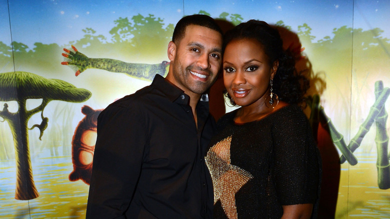 Apollo Nida and Phaedra Parks posing