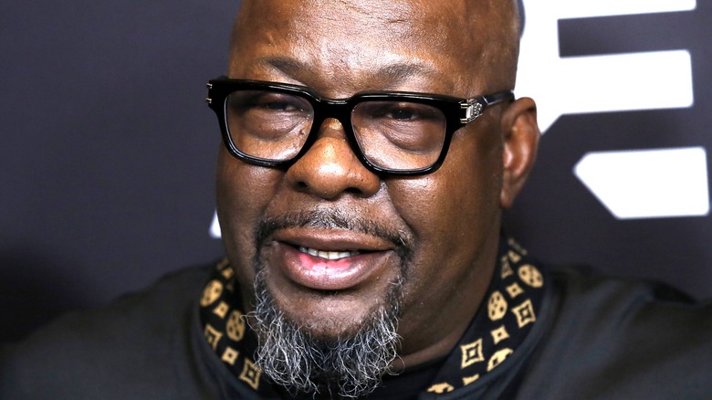 Bobby Brown black rim glasses gray goatee