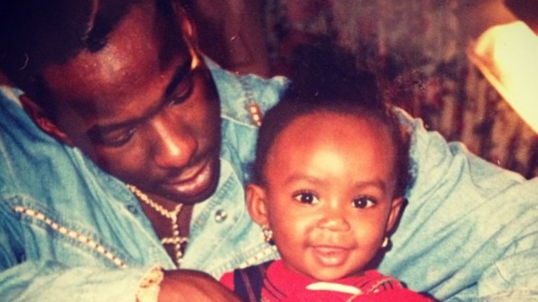 Bobby Brown holding baby La'Princia