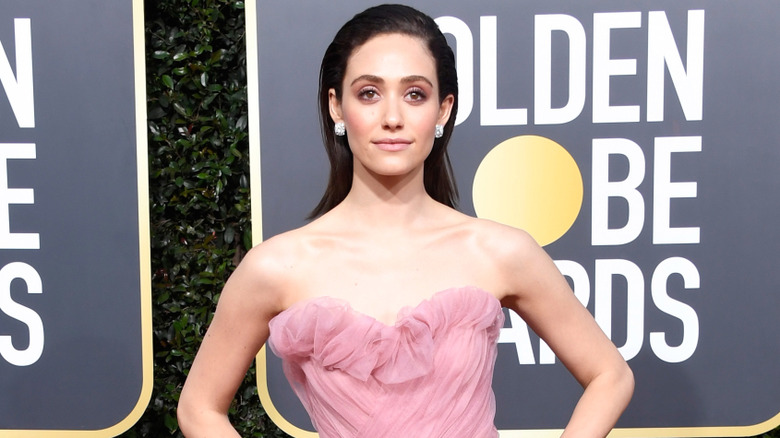 Emmy Rossom with her hair slicked back while attending the Golden Globes