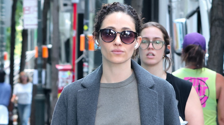 Emmy Rossum walking on a street in New York City