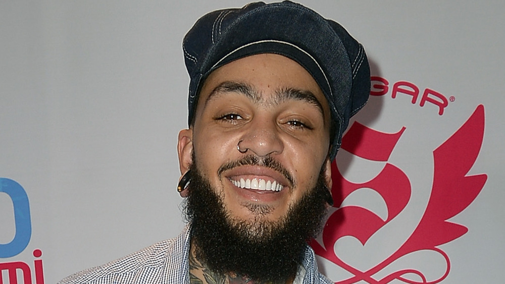 Travie McCoy smiling