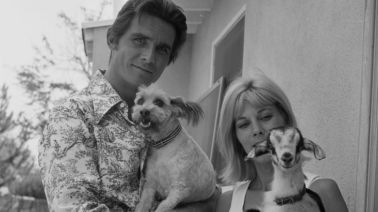 James Brolin and Jane Cameron Agee holding a goat