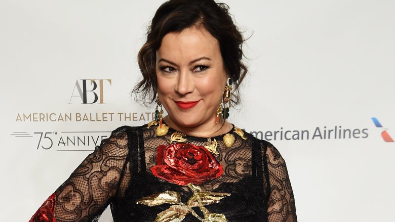 Jennifer tilly in black dress, smiling