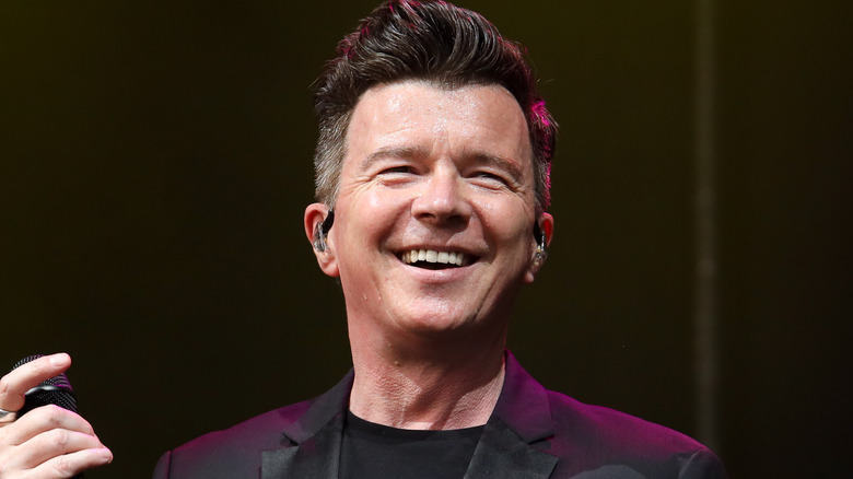 Rick Astley smiling onstage