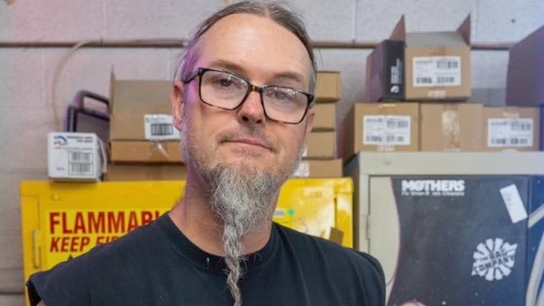 Ryan Evans smirking in garage