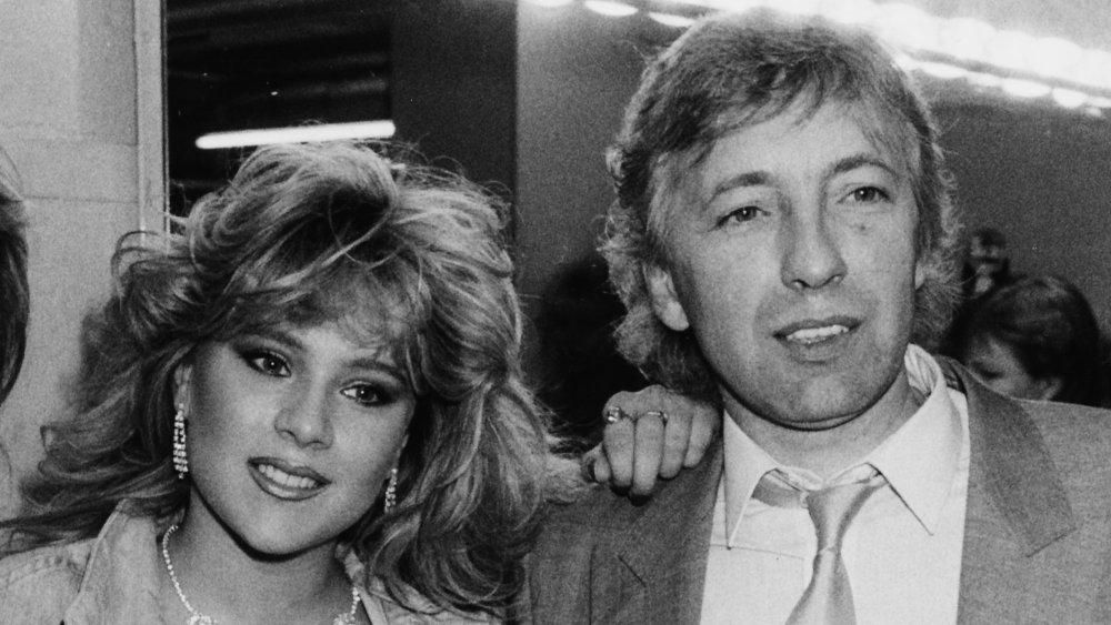 Black-and-white photo of Samantha Fox with her father, John Fox, in the late '80s