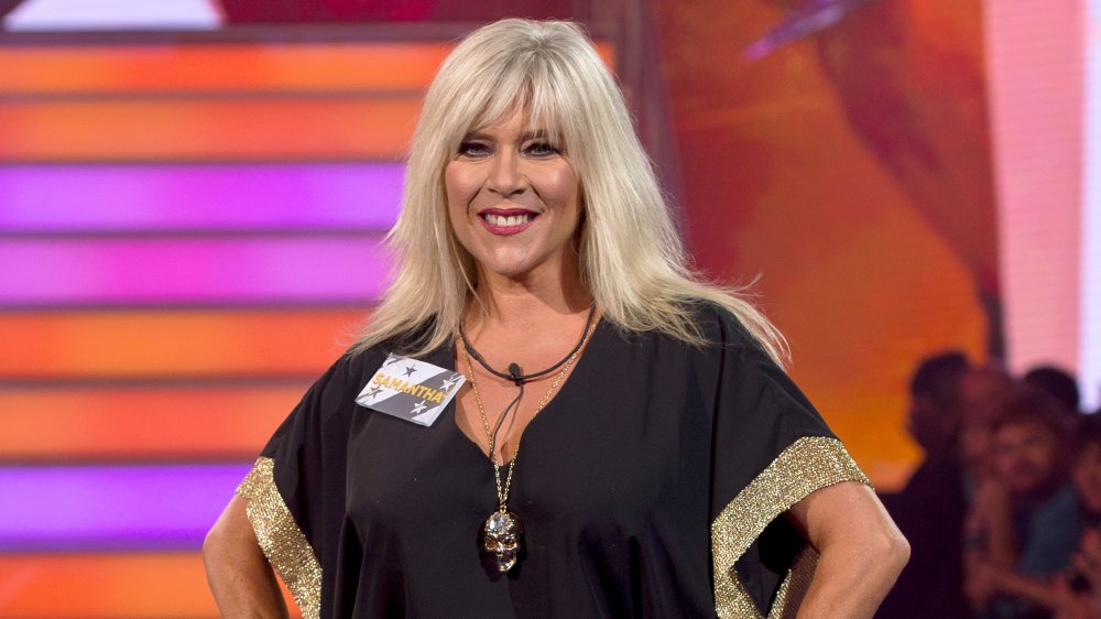 Samantha Fox in a black-and-fold dress, smiling at the Big Brother House