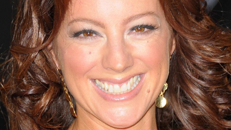 Sarah McLachlan smiling gold earrings