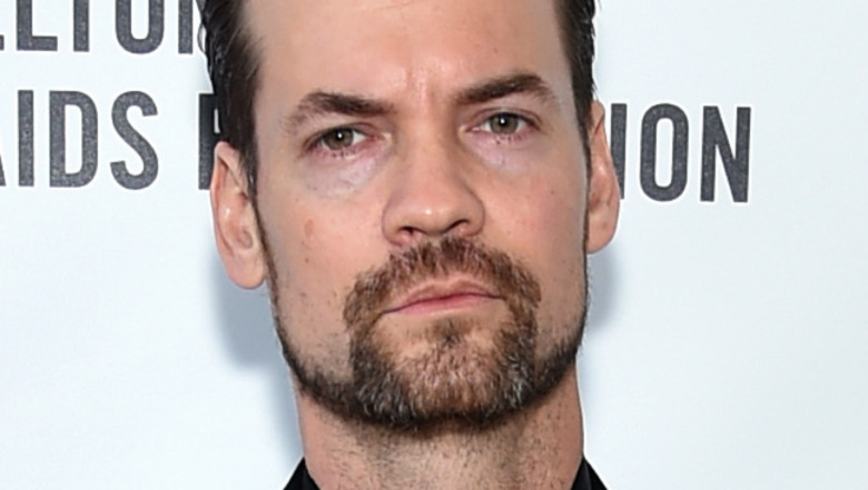 Shane West frowning and posing for photos