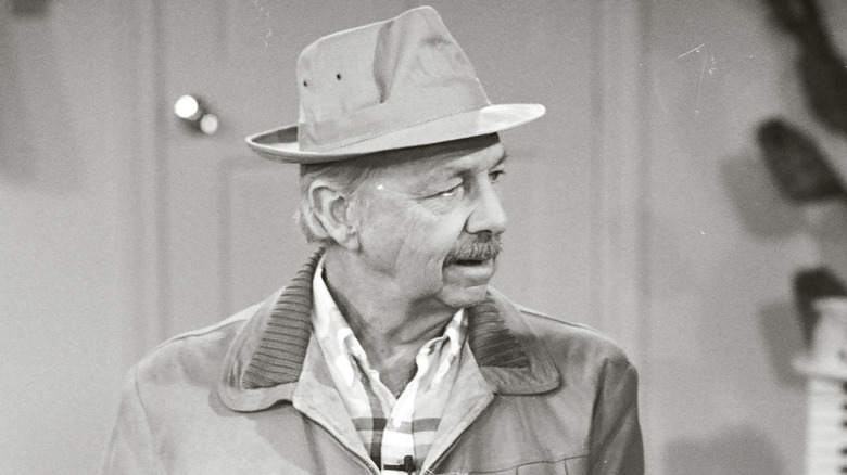 A black and white photo of Alvy Moore wearing a hat