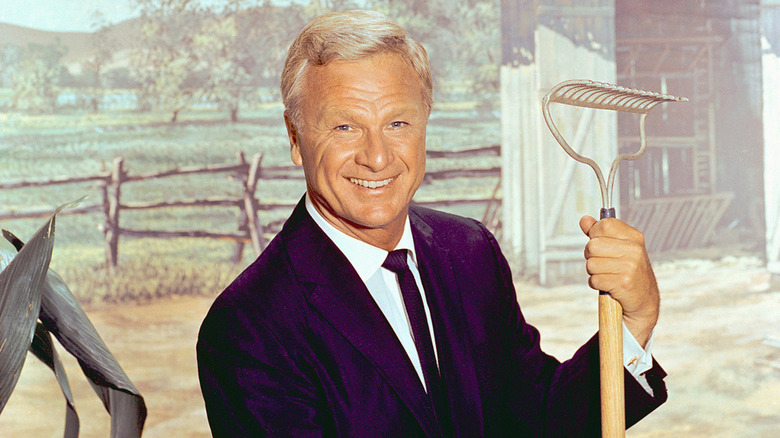 Eddie Albert posing for a photo