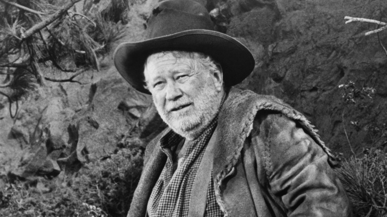 A black and white photo of Edgar Buchanan on set