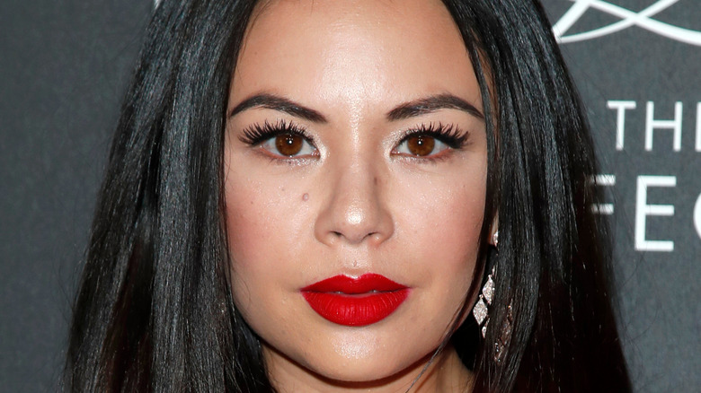 Janel Parrish posing