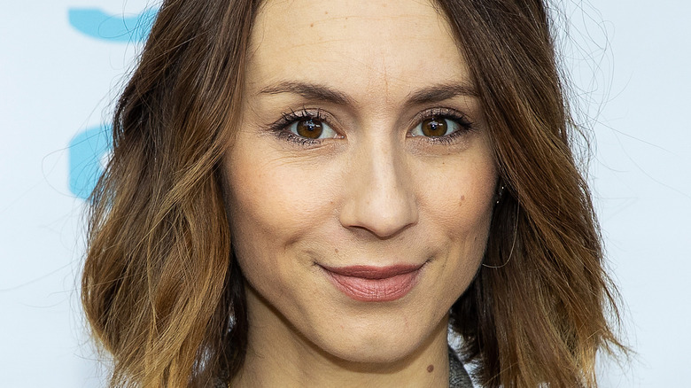 Troian Bellisario smiling