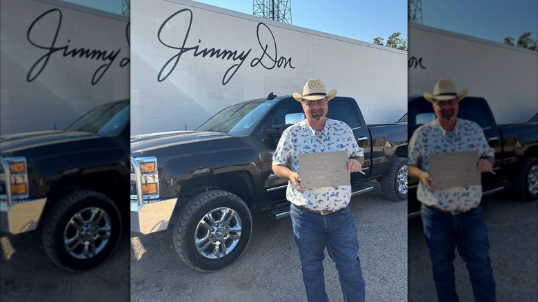 Jimmy Don posing in front of trailer