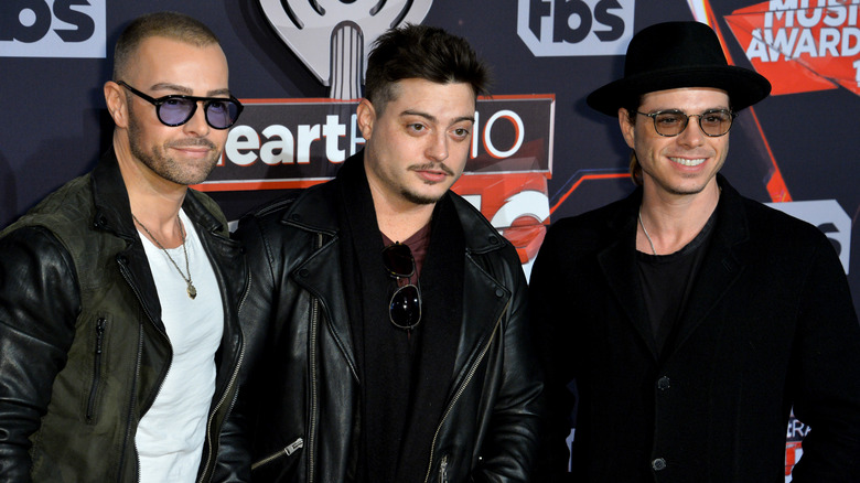 Joey, Andrew, and Matthew Lawrence posing in 2017